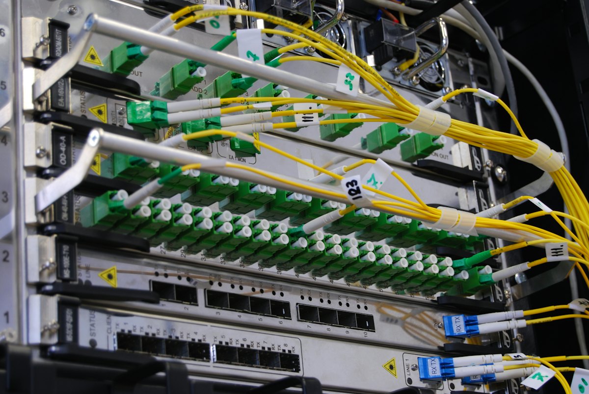 Fiber patch panel and network switch in a rack
